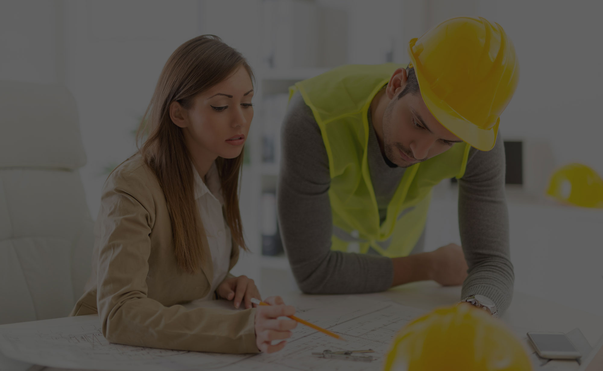 People Looking at Construction Plans People Looking at Construction Plans